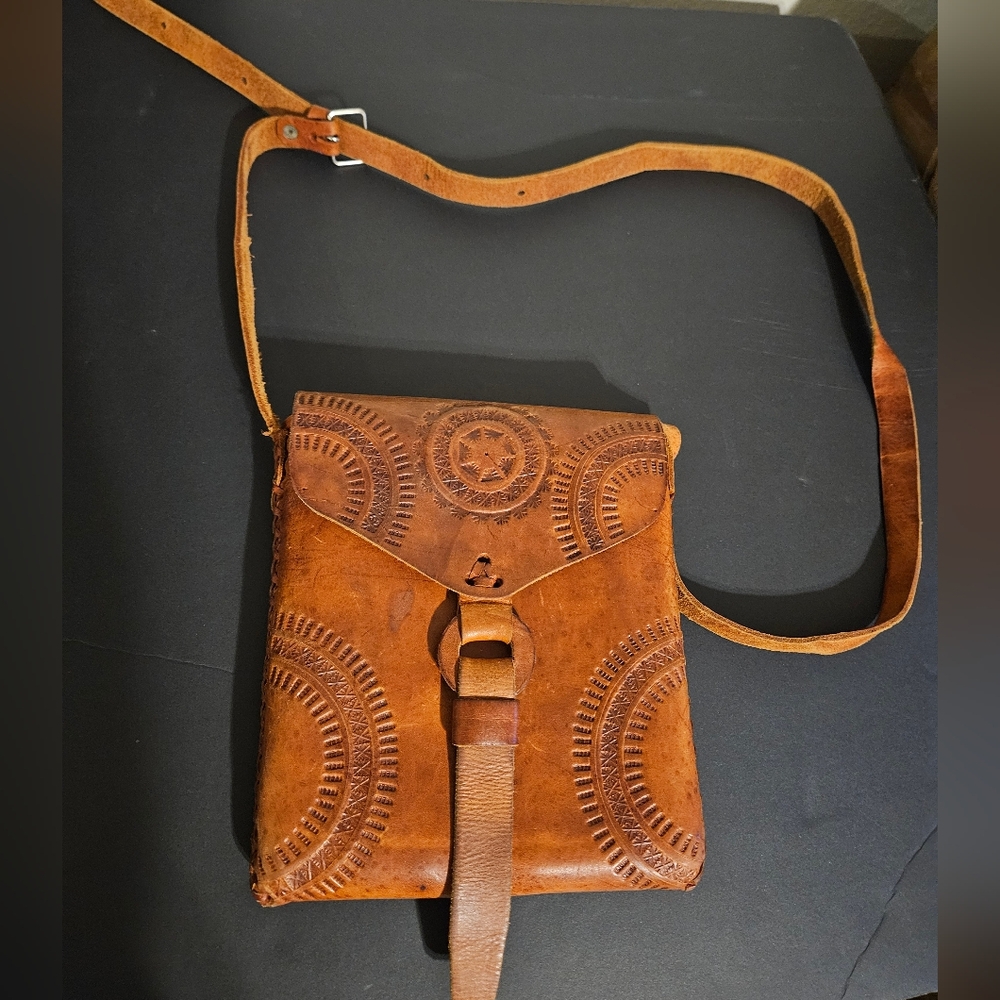 Incredible one of a kind hand tooled vintage leather bag.